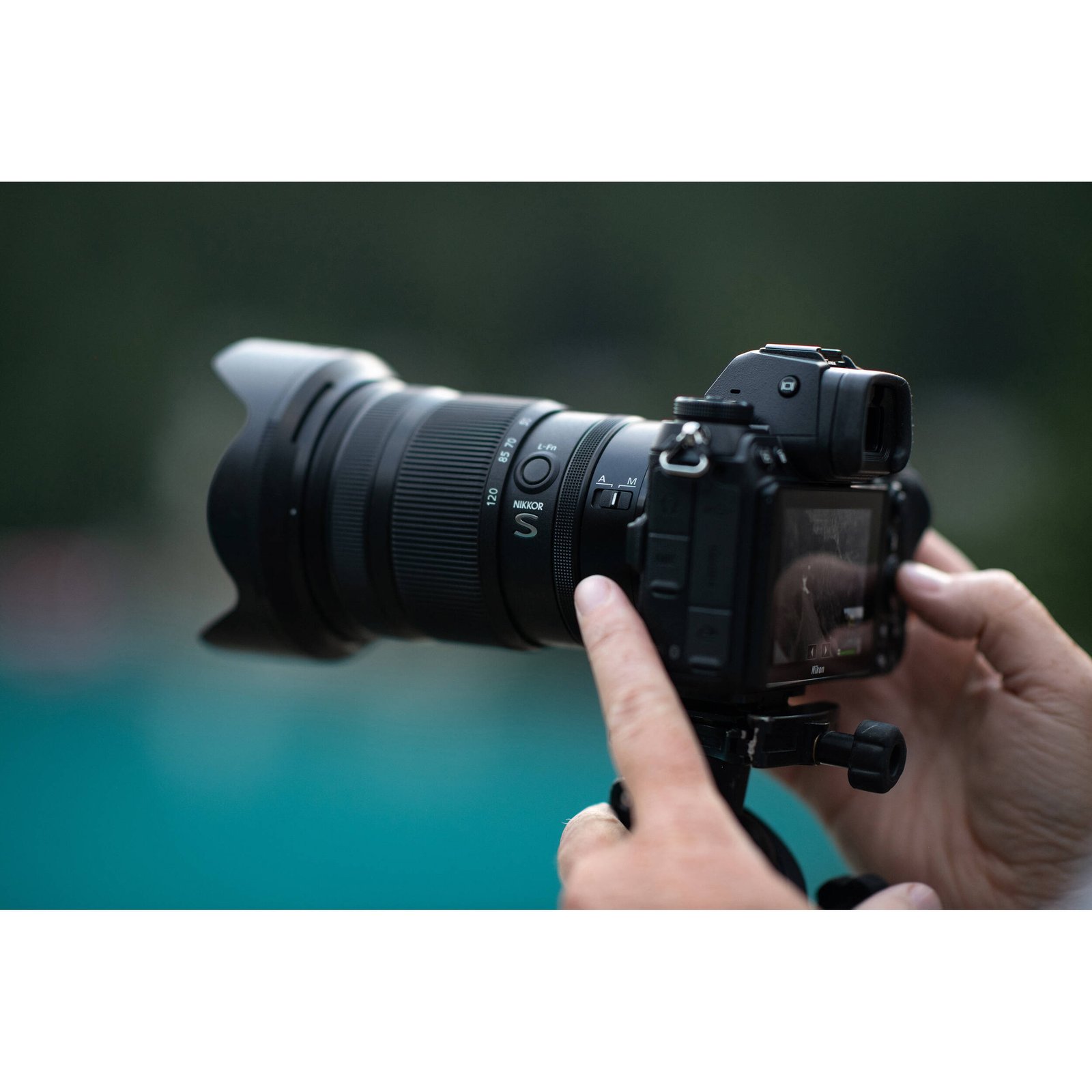 The Nikon Z 24-120mm f/4 S held in hand to show its size