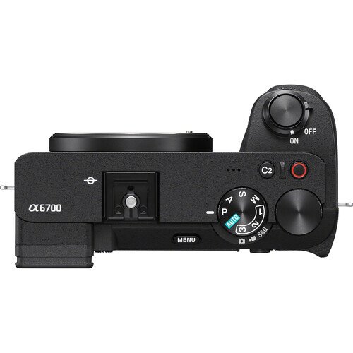 Top panel of the camera body highlighting the exposure mode dial and dedicated video record button.