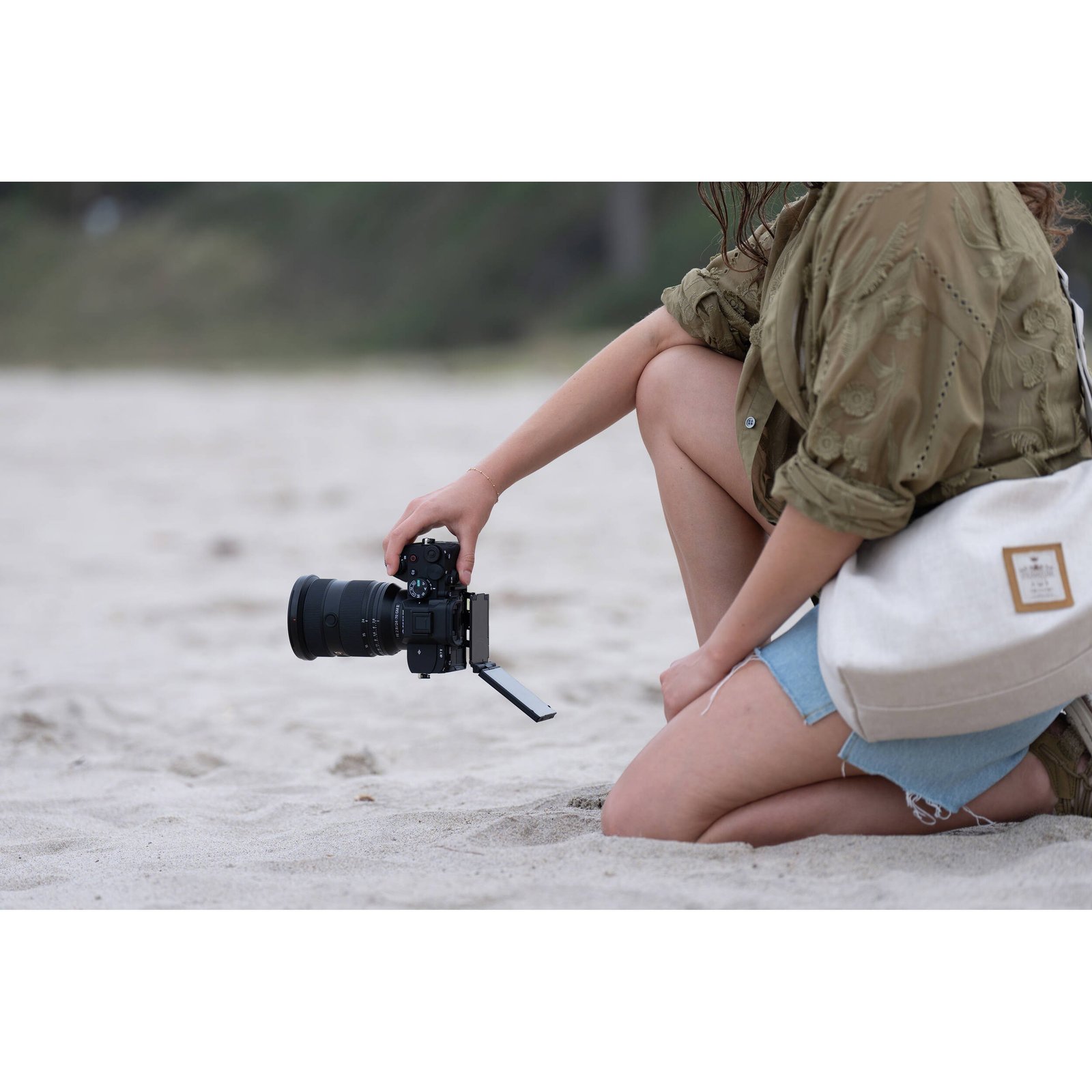 The Sony a7 V held in hand showing its grip and size