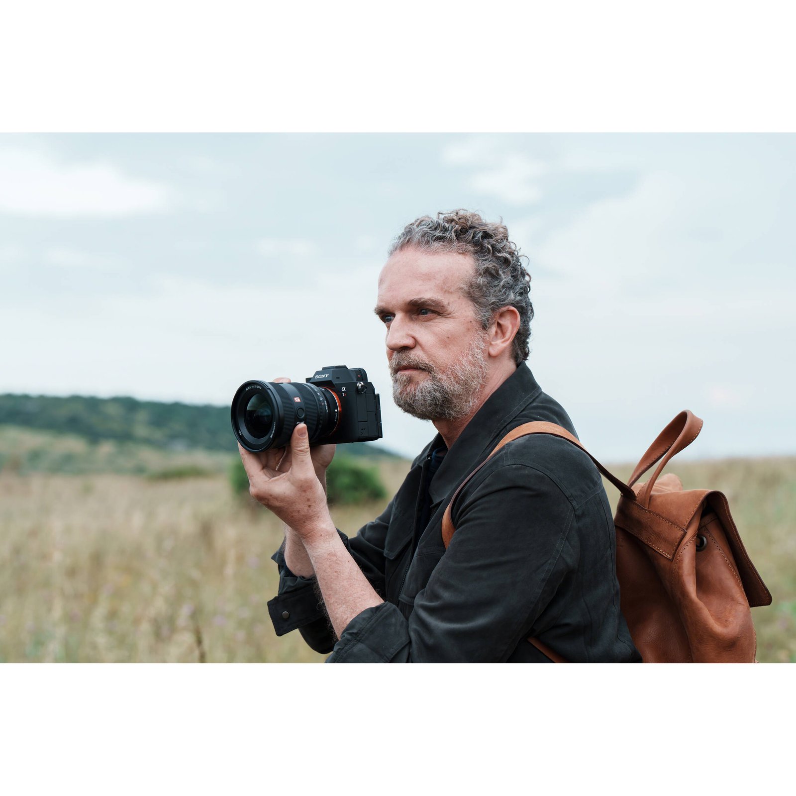 The Sony FE 16-35mm f/2.8 GM II held in hand to show its size