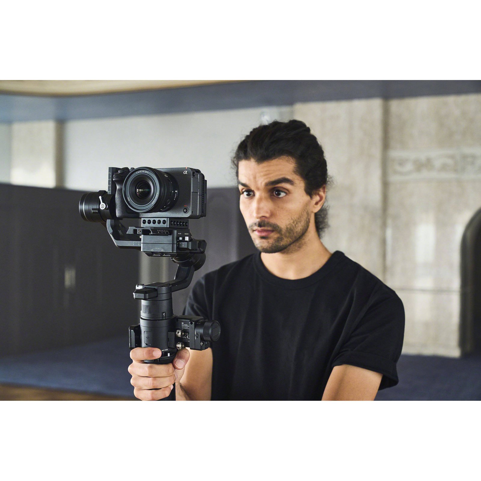 The Sony FX30 held on a gimbal showing its grip and size